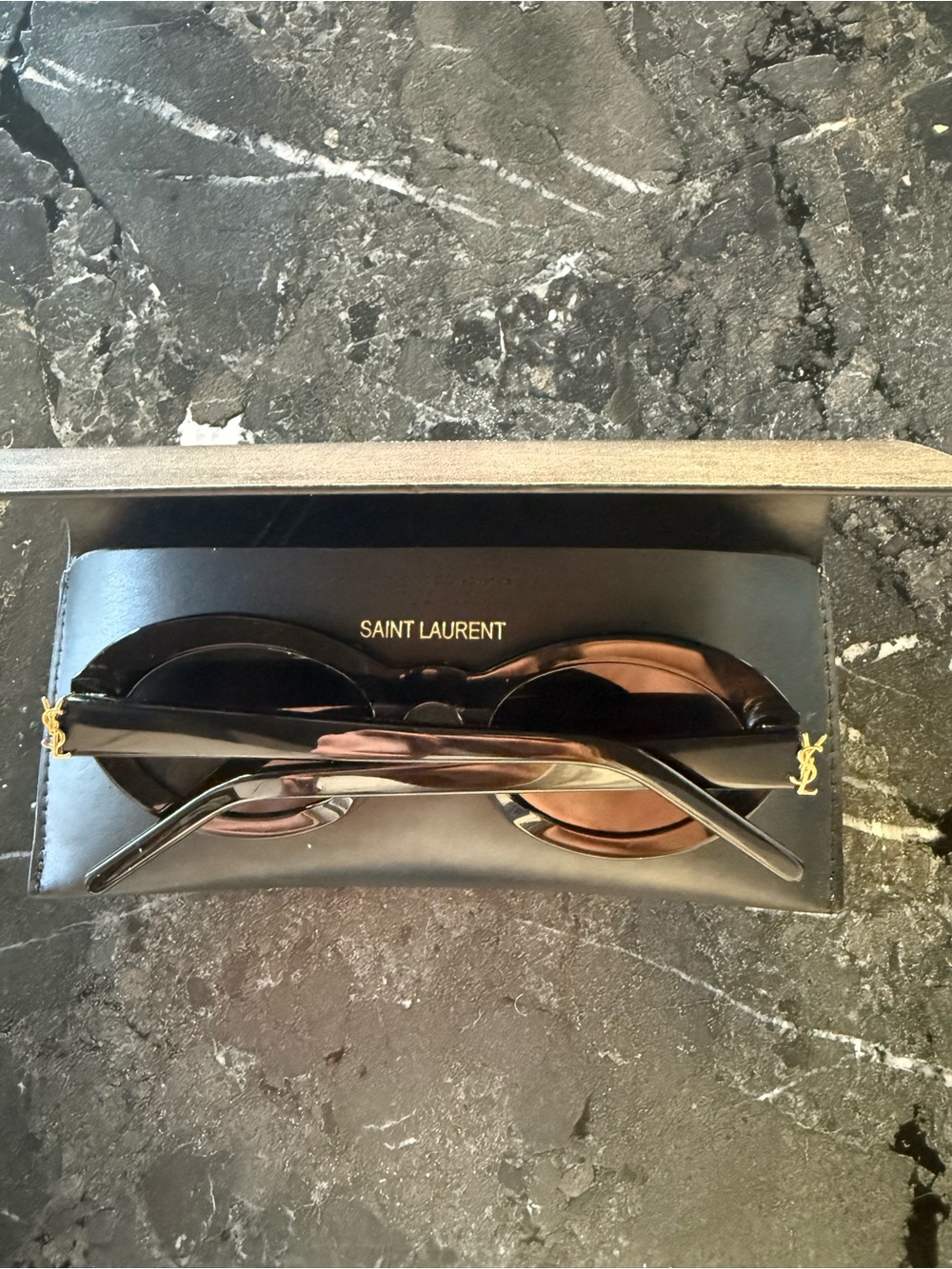 YSL SUNGLASSES WITH OVAL ACETATE FRAMES AND NYLON LENSES.